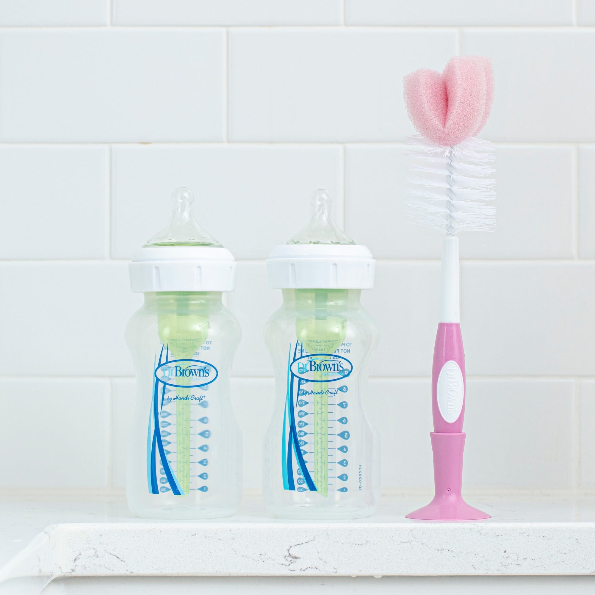 Dr. Brown's Baby Bottle Brush with Suction Cup Stand, Sponge, Scrubber and Nipple Cleaner Pink, 1 Pack